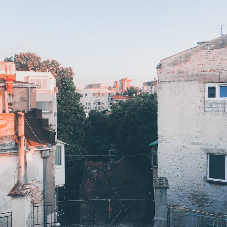 City Buildings Rooftops On Sky Background