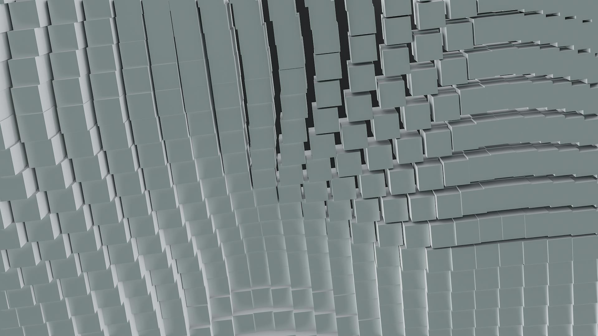 A dynamic abstract pattern of 3D cubes creating waves and curves in grayscale.