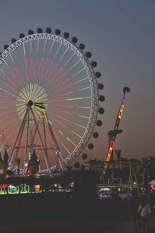 Illuminated Ferris Wheel at Nighttime