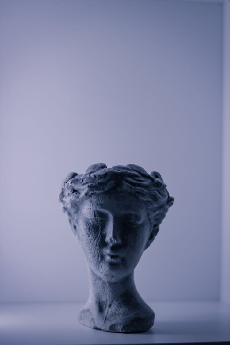 Stone Head Sculpture On White Background