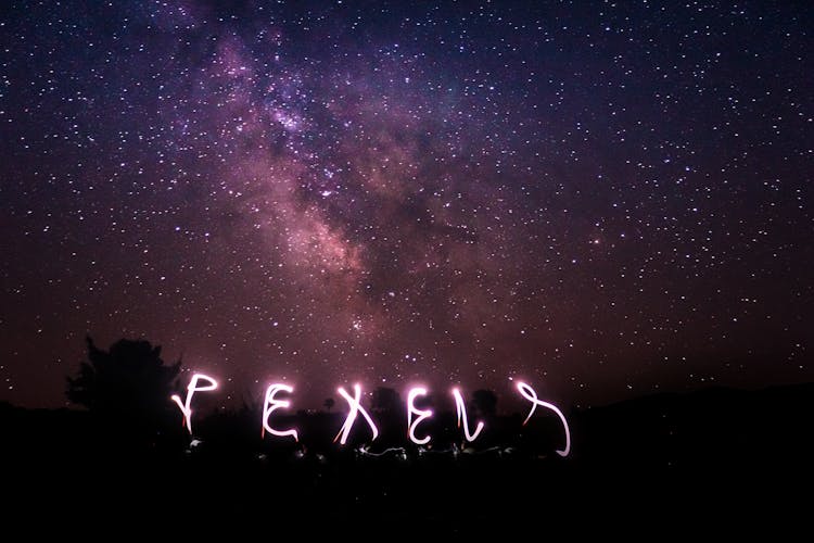 Writing In Night Sky With Long Exposure