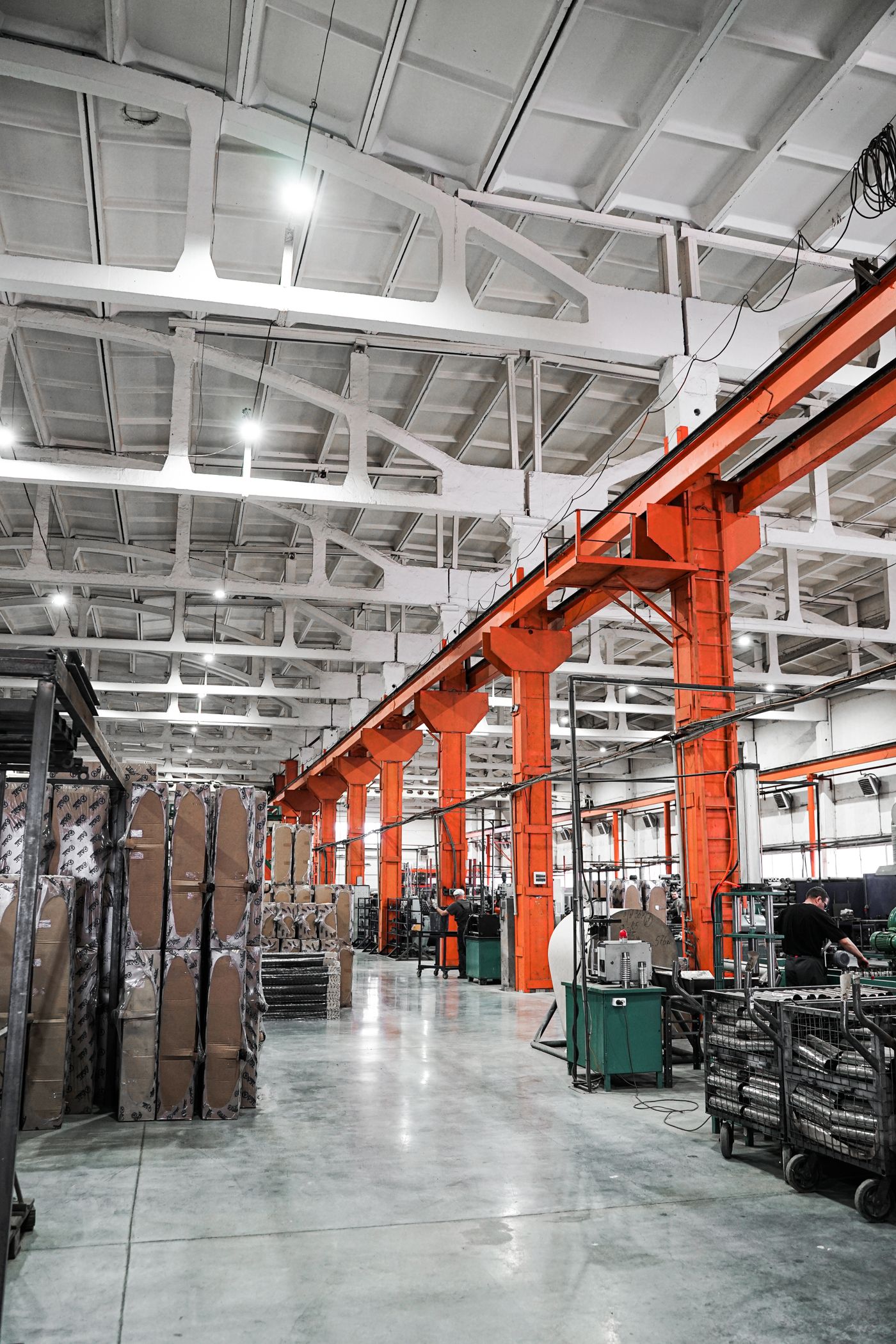 Large manufacturing plant interior with overhead cranes