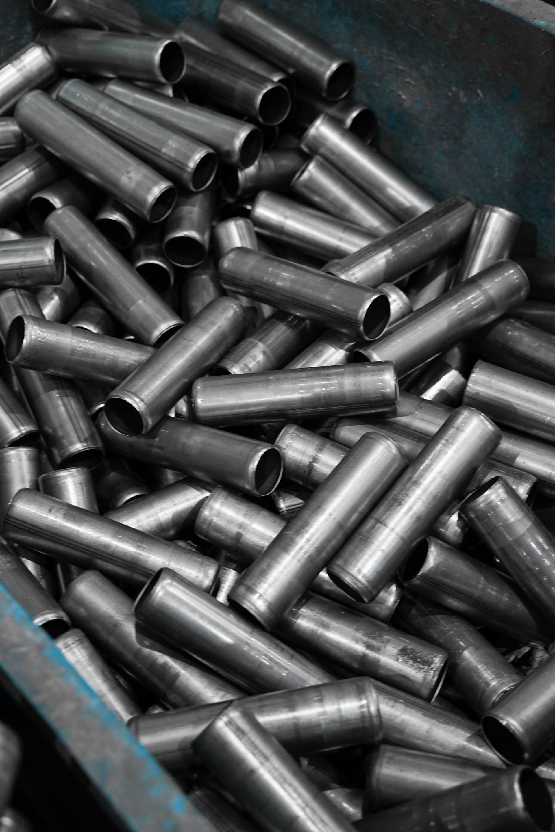 Stainless steel pipes stacked in an industrial container