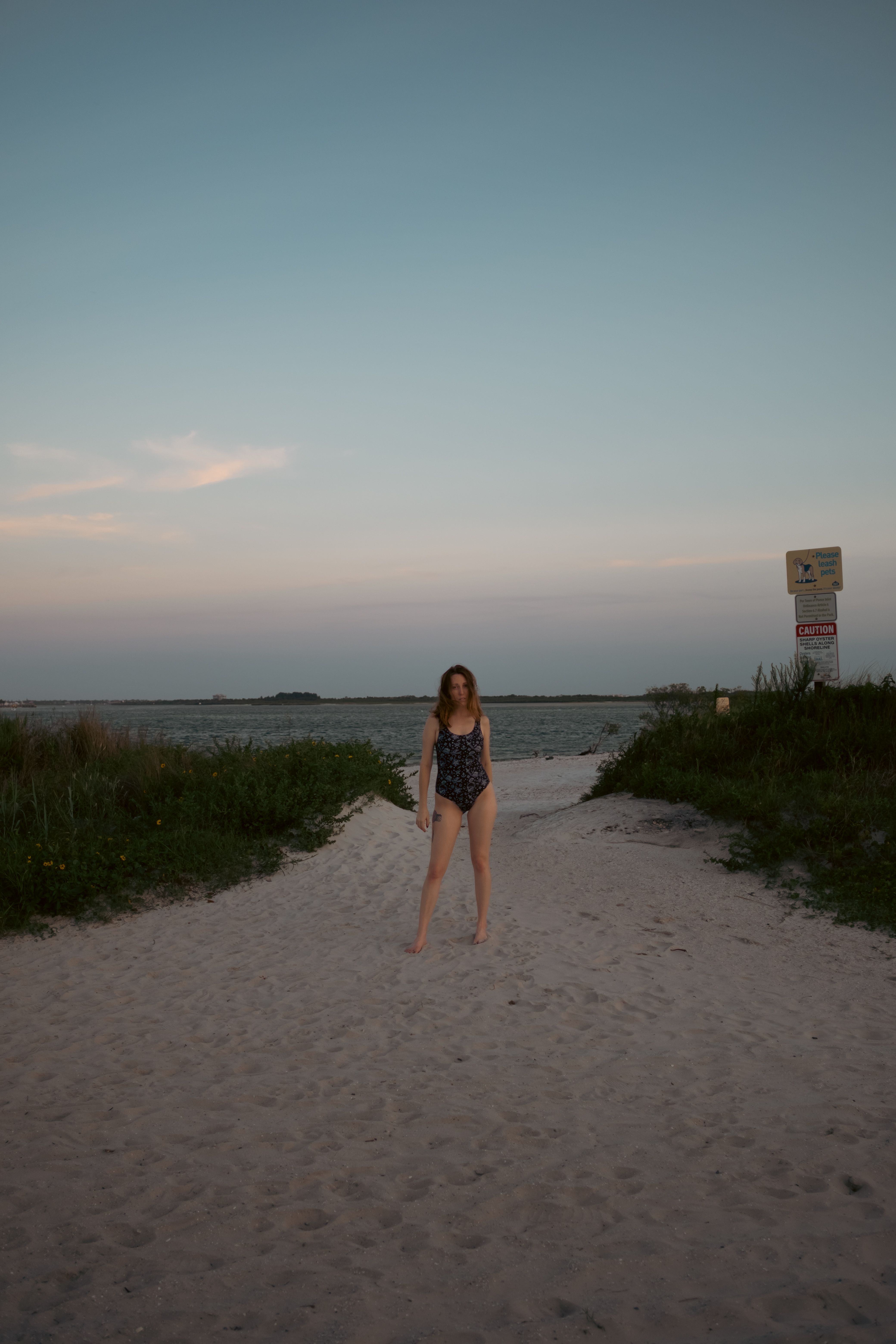 Woman in Swimsuit Posing on Sand Beach on Sunset · Free Stock Photo