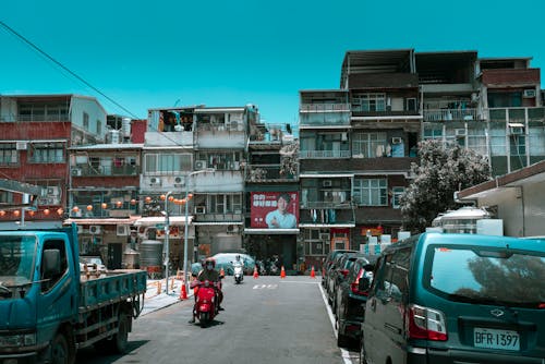 Cars Parked on Street Near Buildings