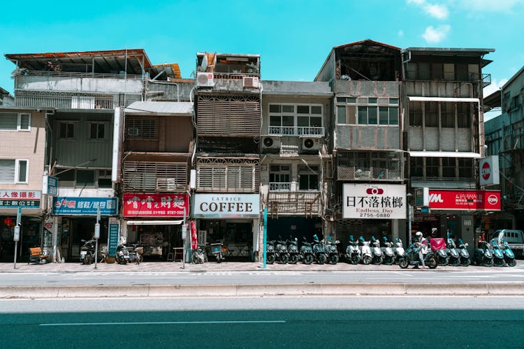 Shop Signs On Old Poor Buildings On City Street