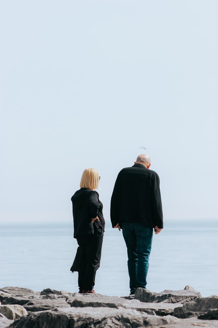 Back Of A Couple Standing On Waterside