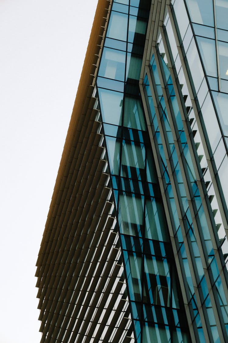 Modern Glass Building Under White Sky