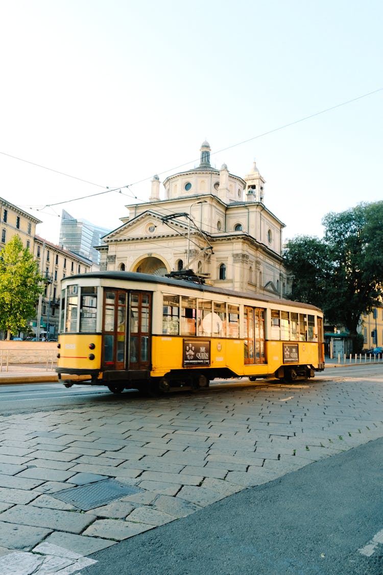 Yellow And White Tram On Road