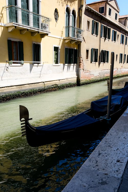 Gondola in Canal in Street in Venice