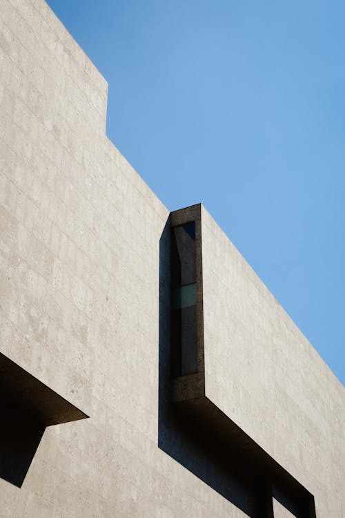 Foto profissional grátis de arquitetura, céu azul, concreto