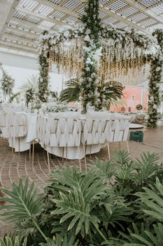 Stunning outdoor wedding setup with lush floral arrangements and elegant table settings, perfect for celebrations.