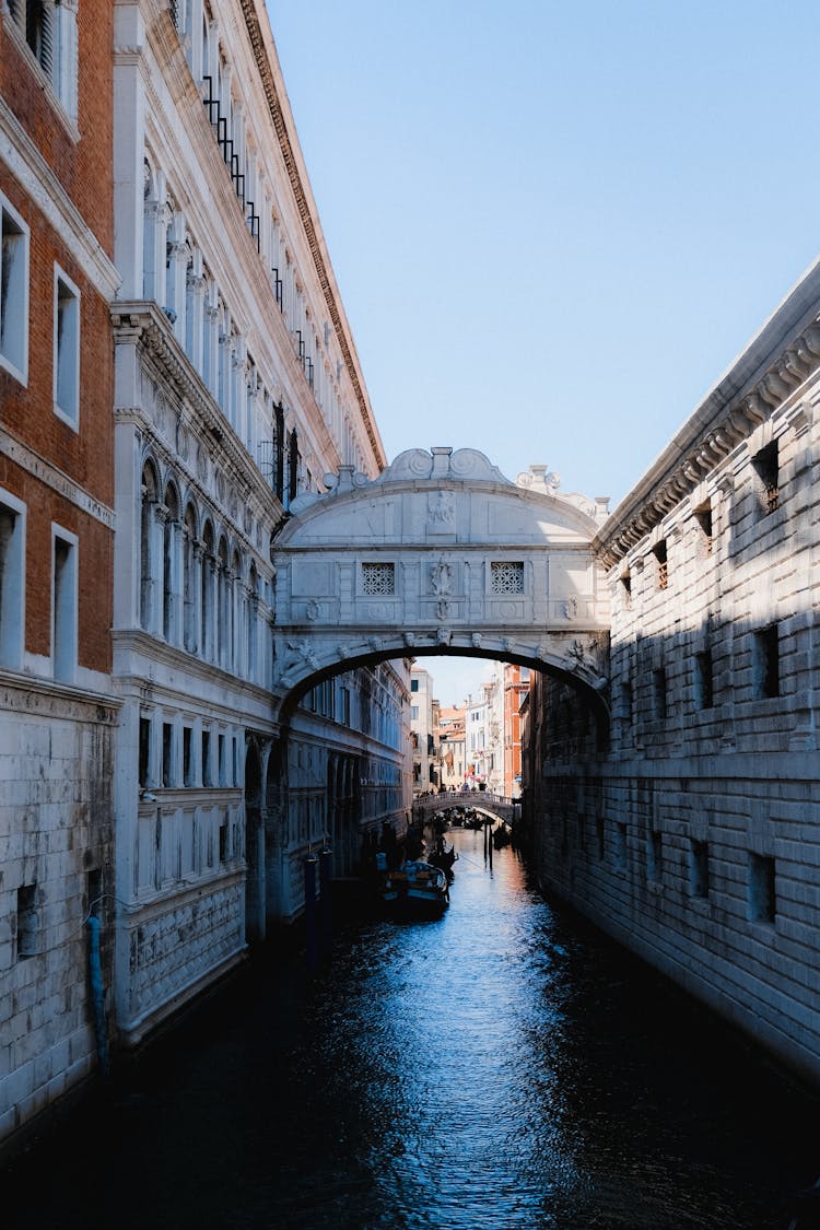 Old Buildings With Bridge At Canal