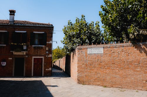 Building Near Break Wall and Green Trees