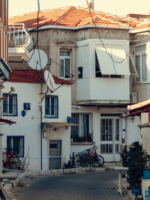 Free Quaint urban street with classic architecture, bicycles, and vibrant charm. Stock Photo