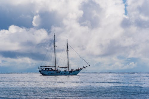 Ship on Sea Under White Clouds