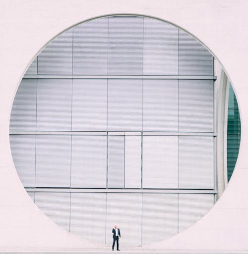 Free Person in Front of Gray Structure Stock Photo