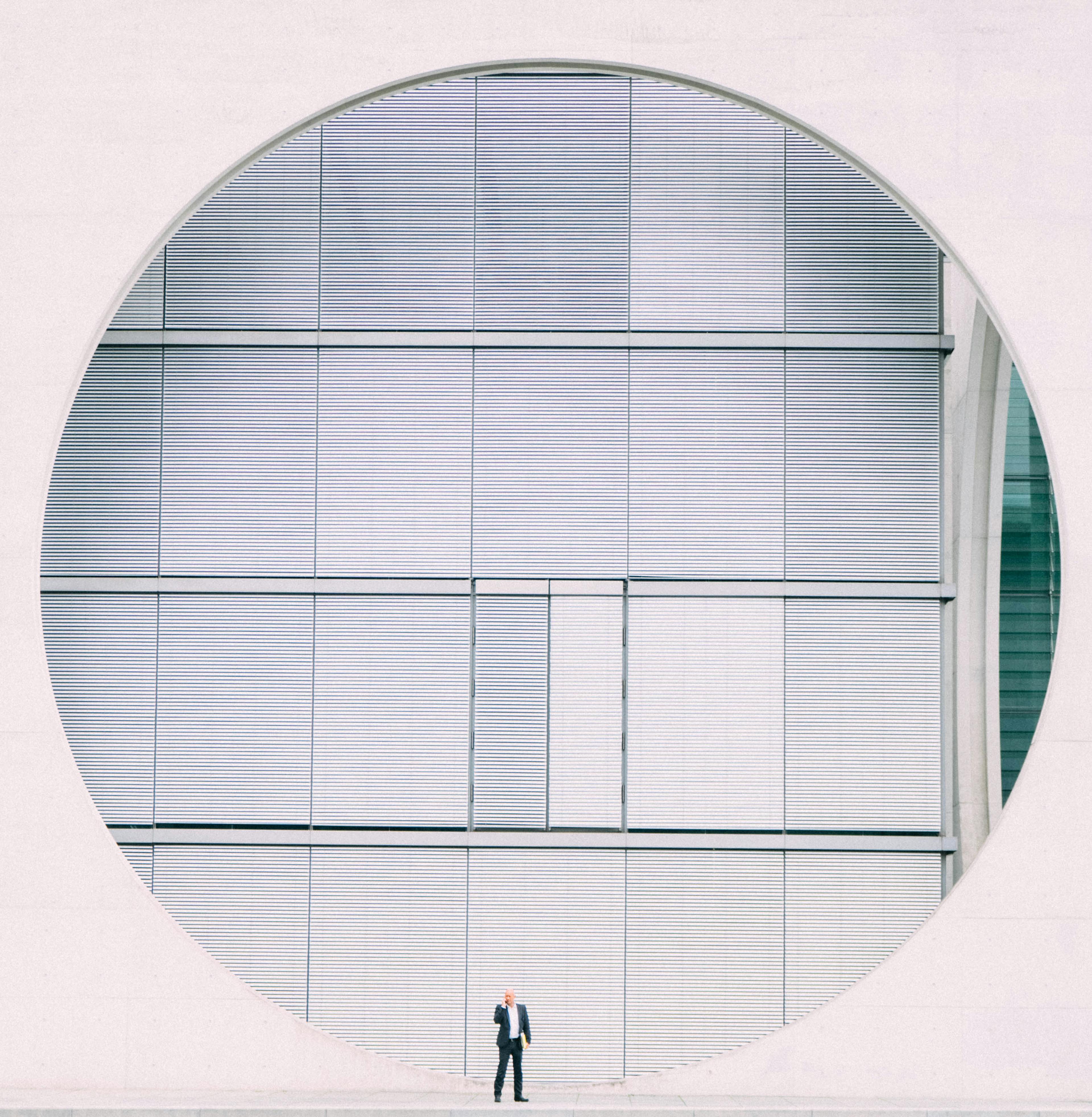 Person in Front of Gray Structure