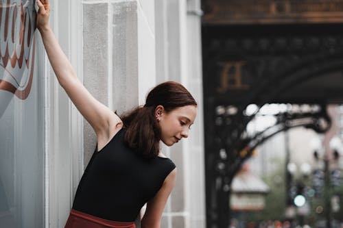 A Woman in Black Tank Top Ballet Dancing