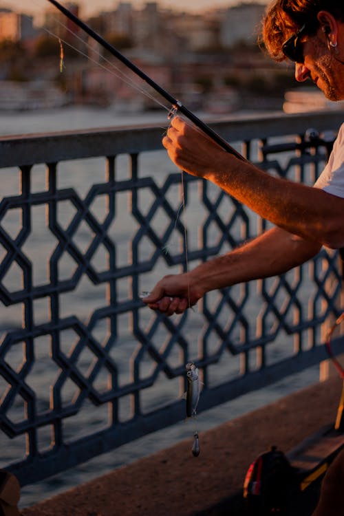 Person Holding Fishing Rod