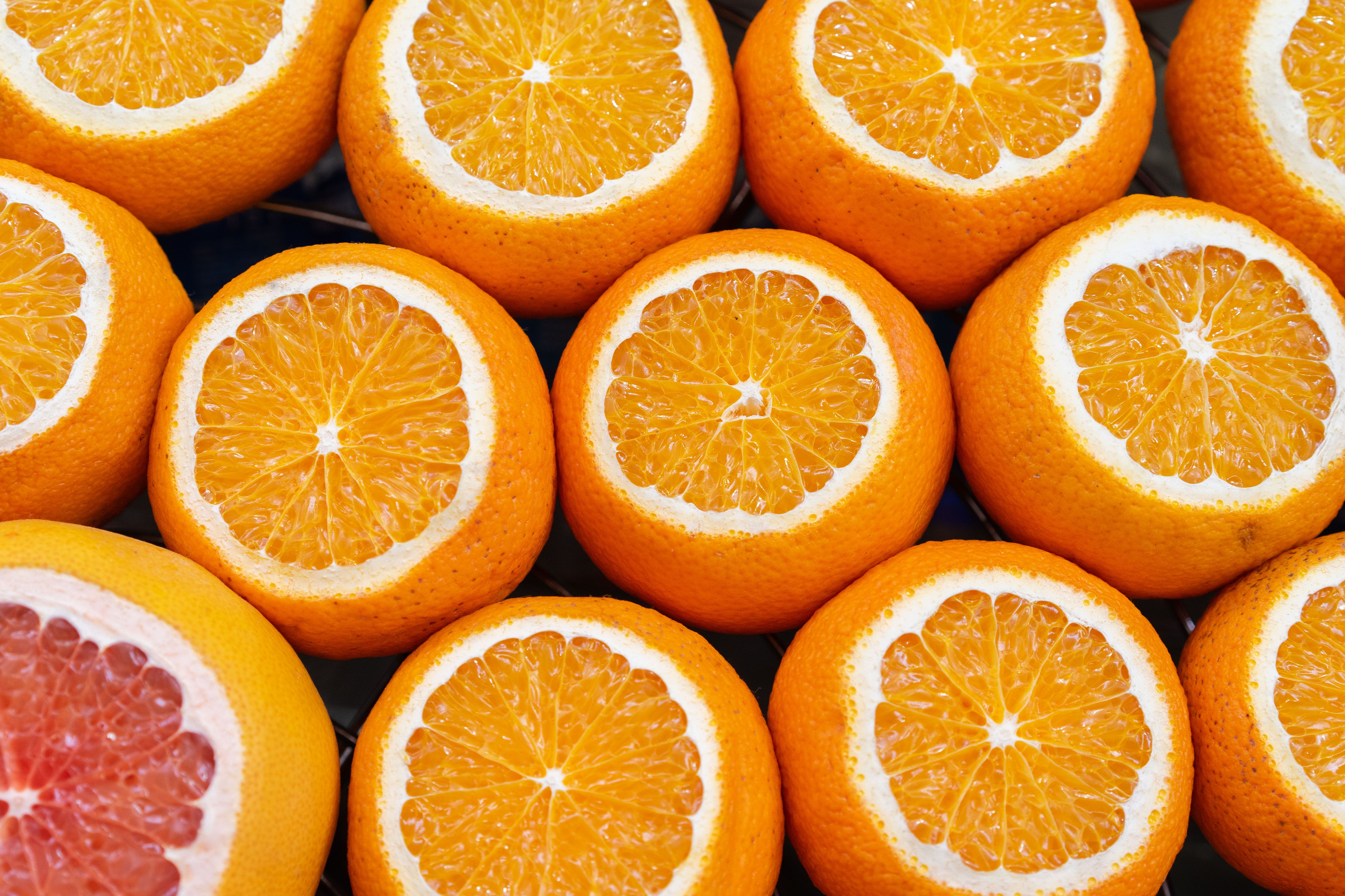 Vibrant close-up image of sliced oranges and grapefruit, showcasing juicy textures.