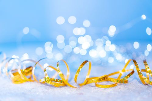 Free Golden ribbon on snowy surface with sparkling lights, perfect for festive celebrations. Stock Photo