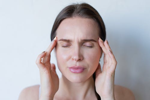 Woman Feeling a Strong Head Pain