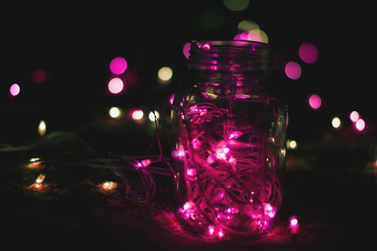 Pink String Lights On Clear Glass Mason Jar