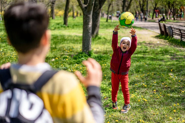 A Boy Catching A Ball