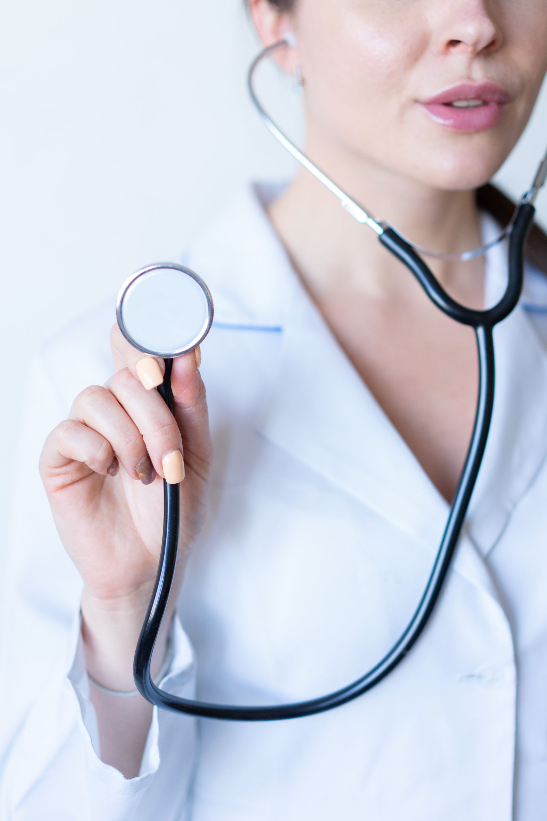 Doctor holding a stethoscope representing trusted healthcare reputation