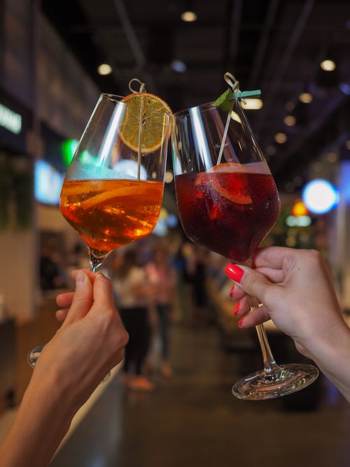 Free Elegant glassware clinking with colorful cocktails, perfect for celebrations. Stock Photo