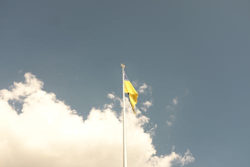 Flag of Ukraine Under Blue Sky