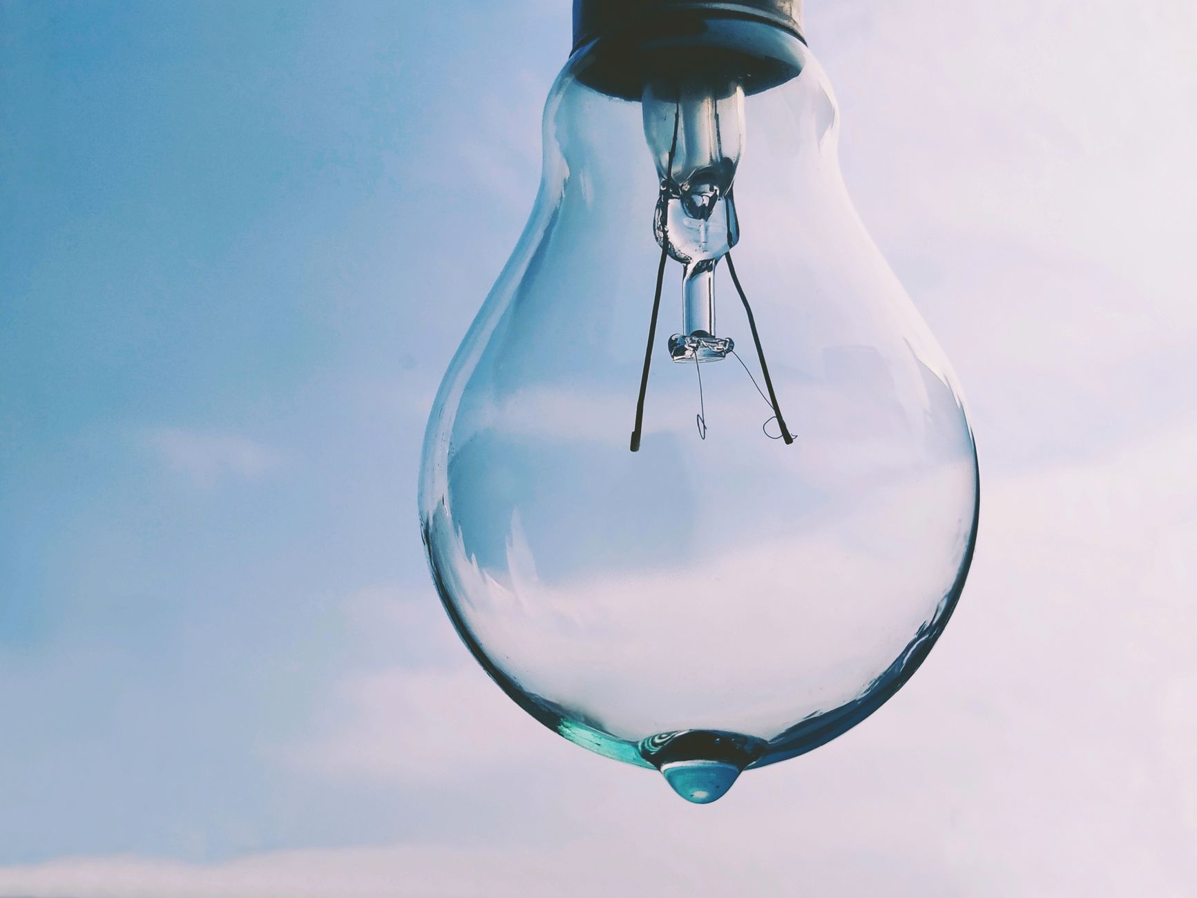 Close-Up Photo of a Light Bulb with a Water Drop