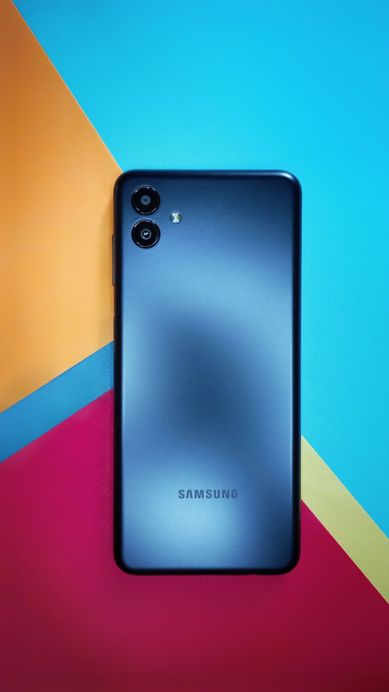Samsung smartphone placed on a colorful geometric patterned surface