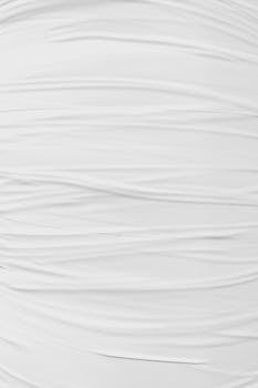 Close-up of crinkled white fabric texture for a minimalist and modern design background.