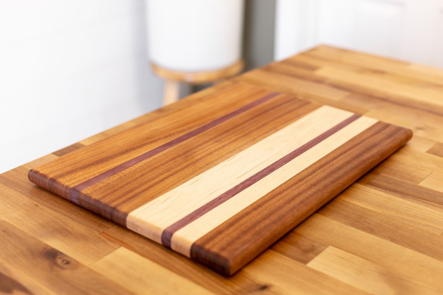 Wooden cutting board arranged on a bright kitchen work surface