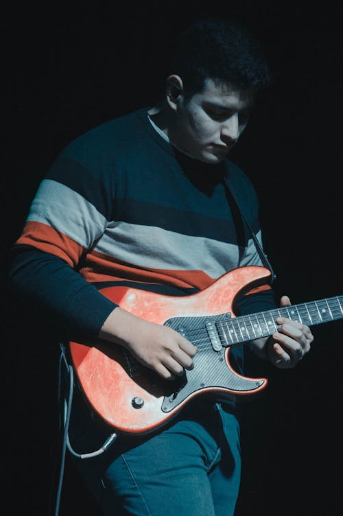 A Man Playing an Electric Guitar