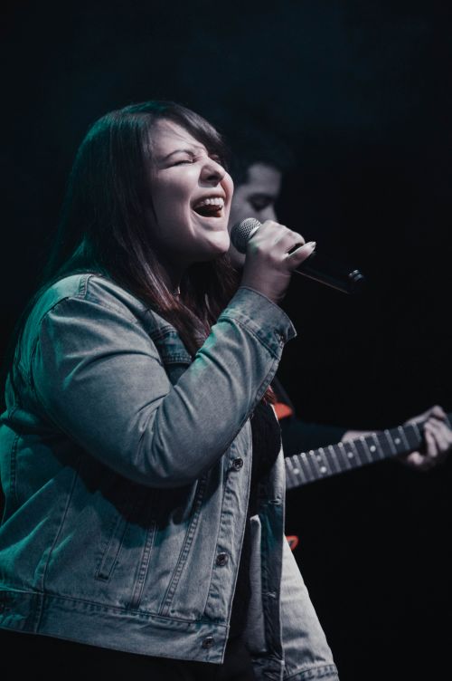 Blonde Woman Singing on Stage · Free Stock Photo