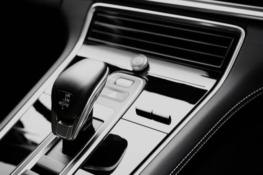 Sleek modern car interior showcasing a luxurious automatic gearbox and sophisticated design.