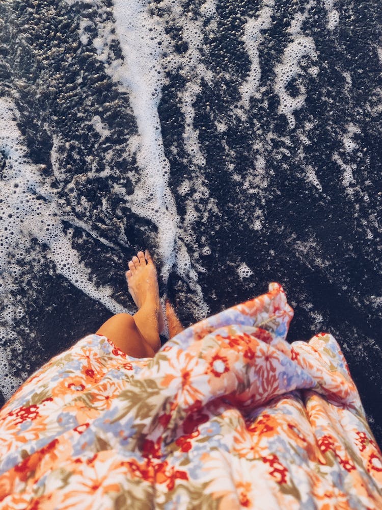 Photo Of The Feet Of A Person Walking On The Beach