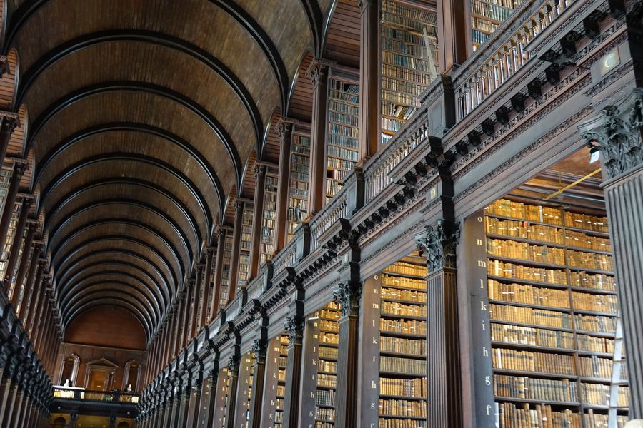 Expansive view of the historic Long Room library in Trinity College Dublin
