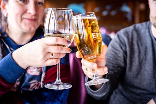 A Close-Up Shot of a Couple Toasting