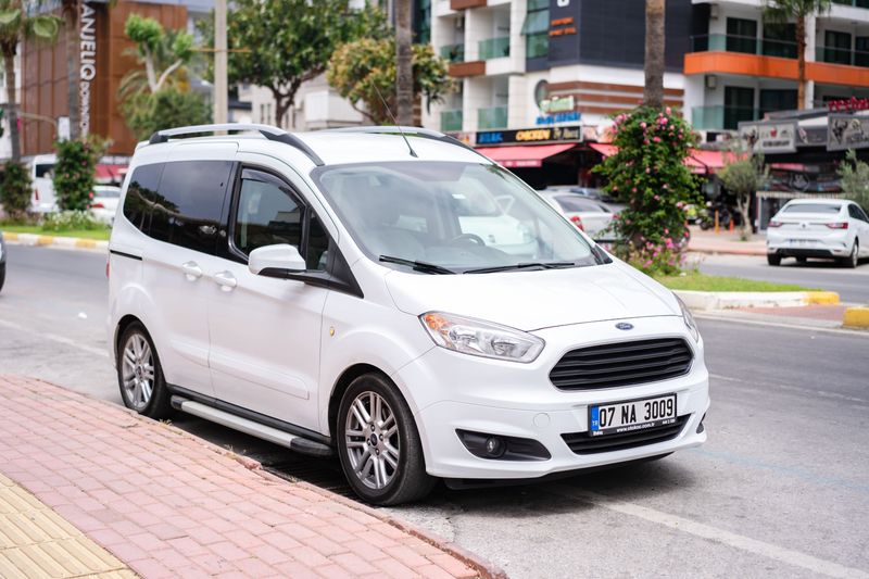 White minivan on city street