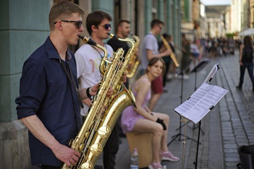 Free Street Musicians Playing the Saxophones Stock Photo