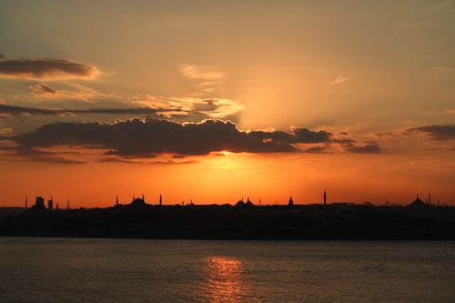 Free Silhouette of Istanbul skyline during a breathtaking sunset over the Bosphorus Sea. Stock Photo