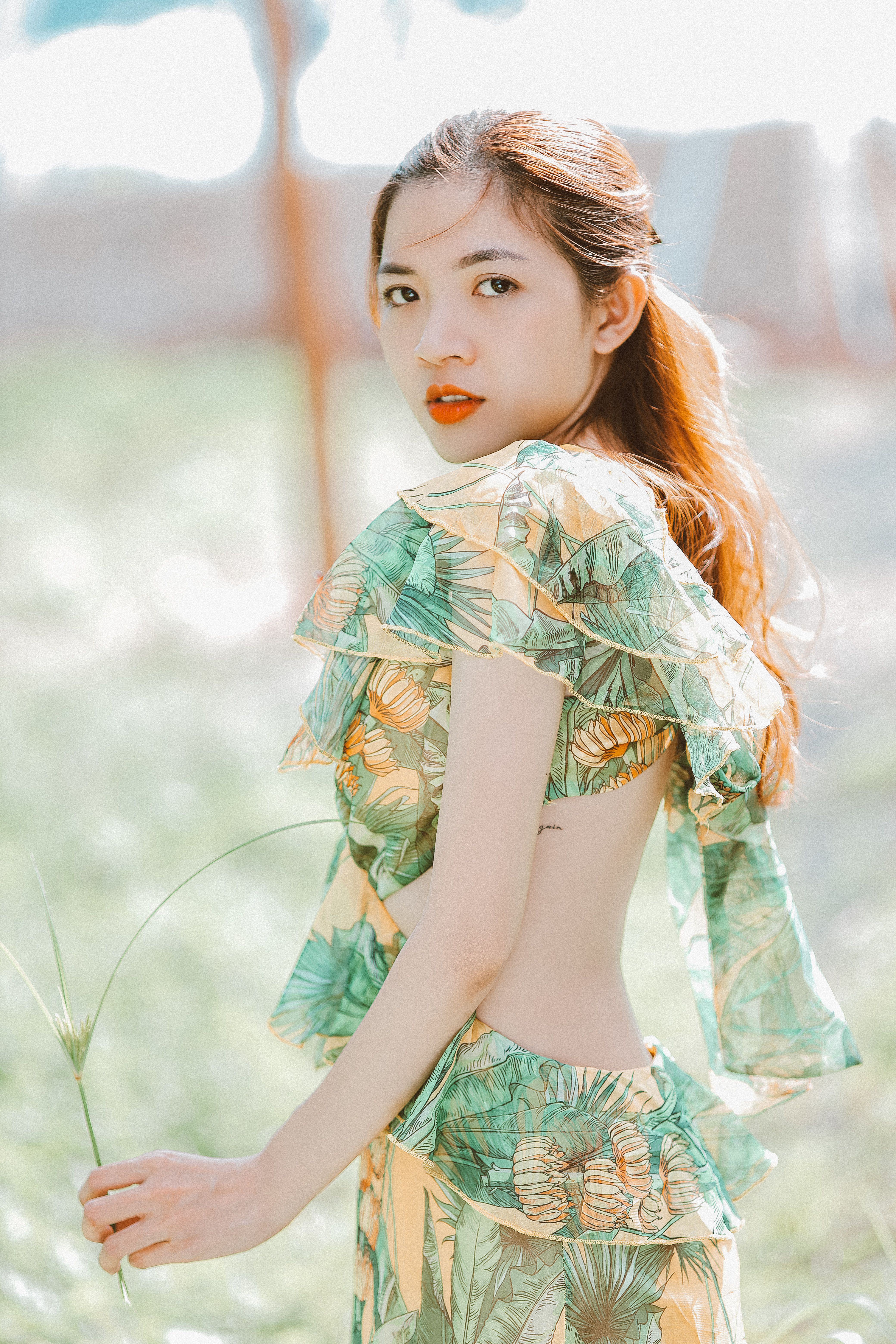 A Woman Green Dress Looking at the Camera · Free Stock Photo