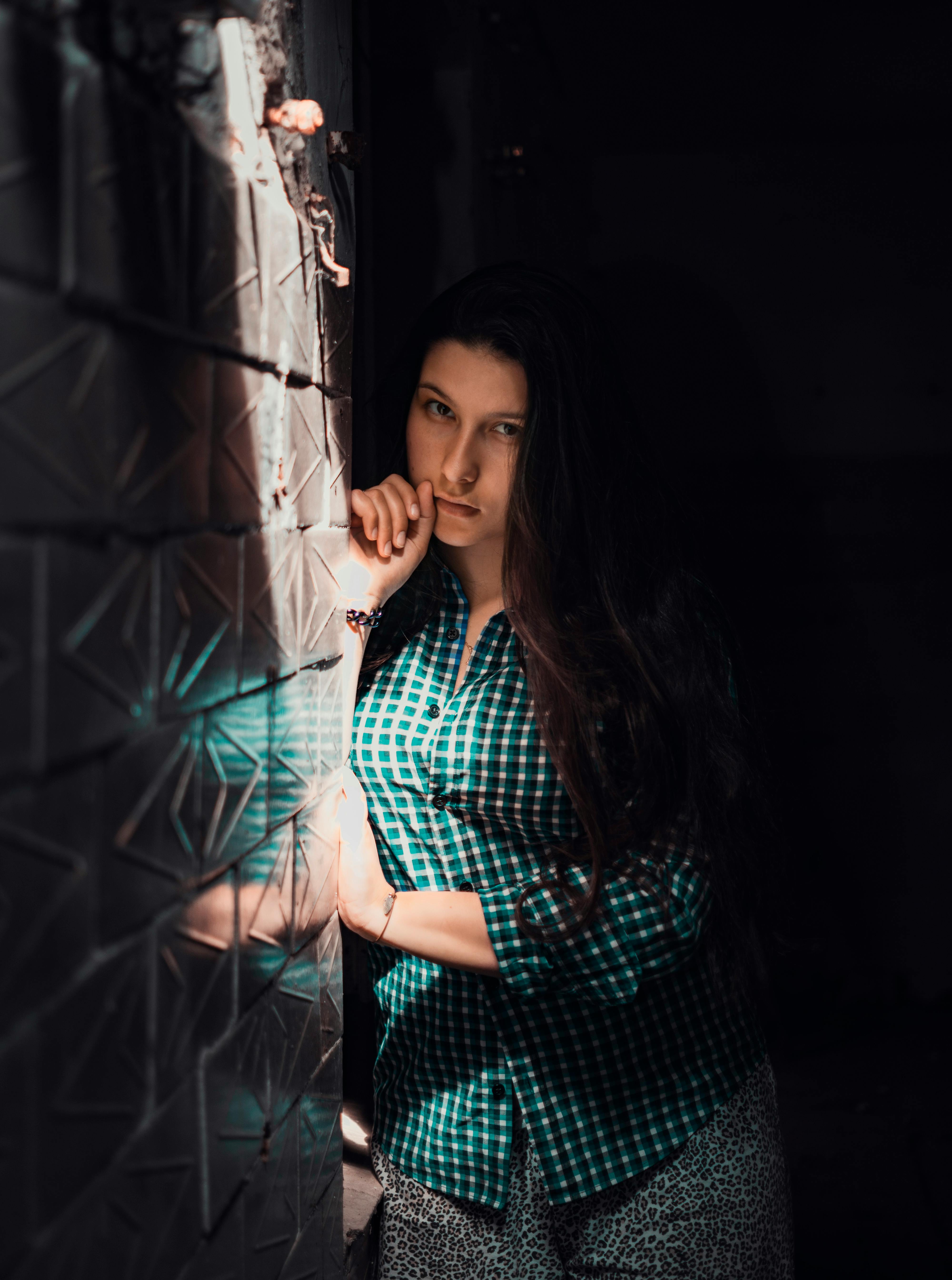 Selective Focus Photography Of Woman Learning On Wall · Free Stock Photo