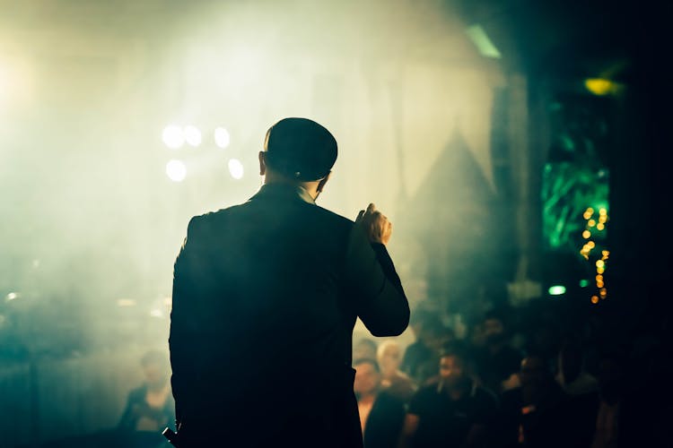 Performer Standing In Front Of An Audience