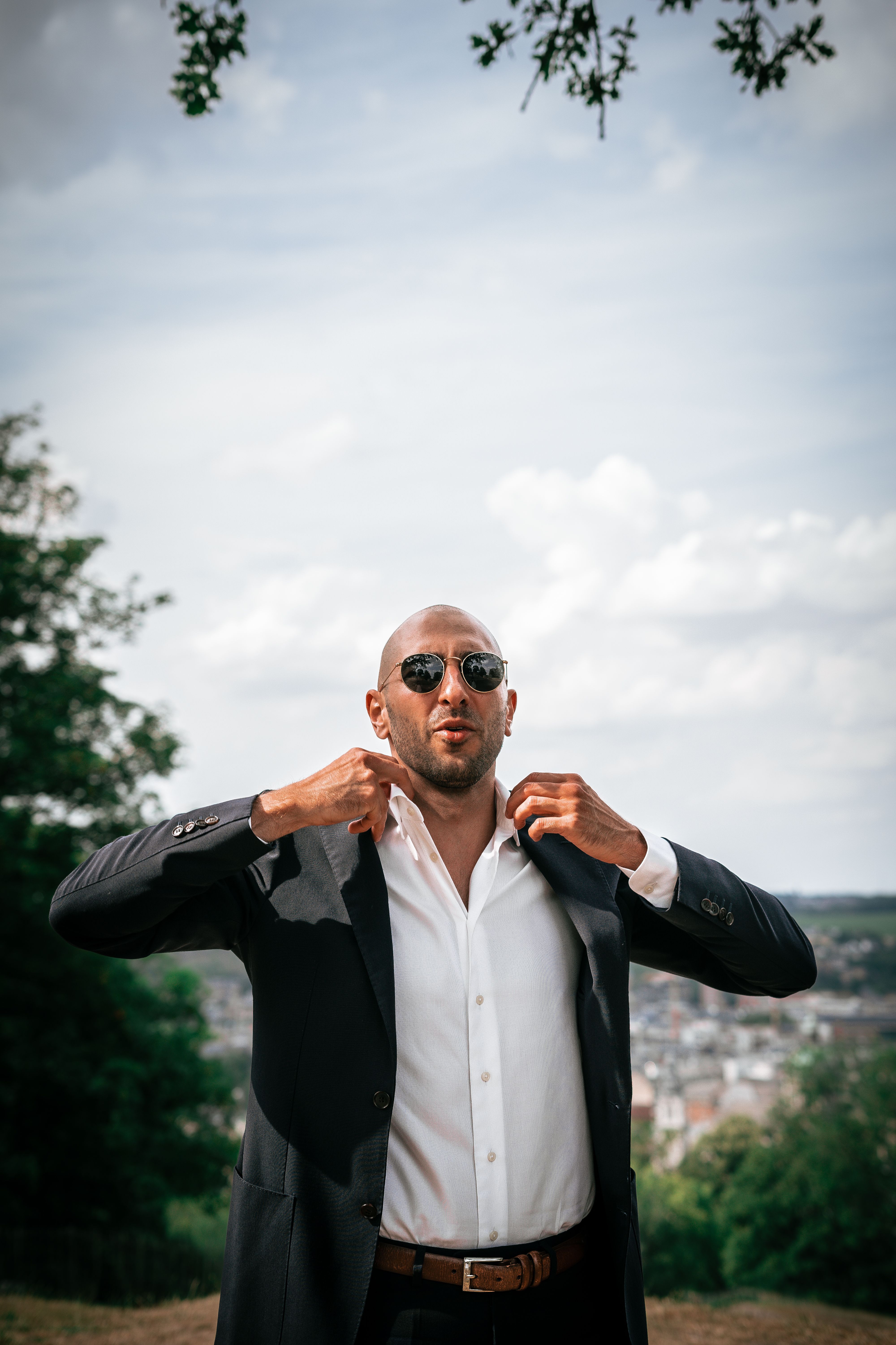A Man in Black Suit Jacket Wearing Black Sunglasses · Free Stock Photo