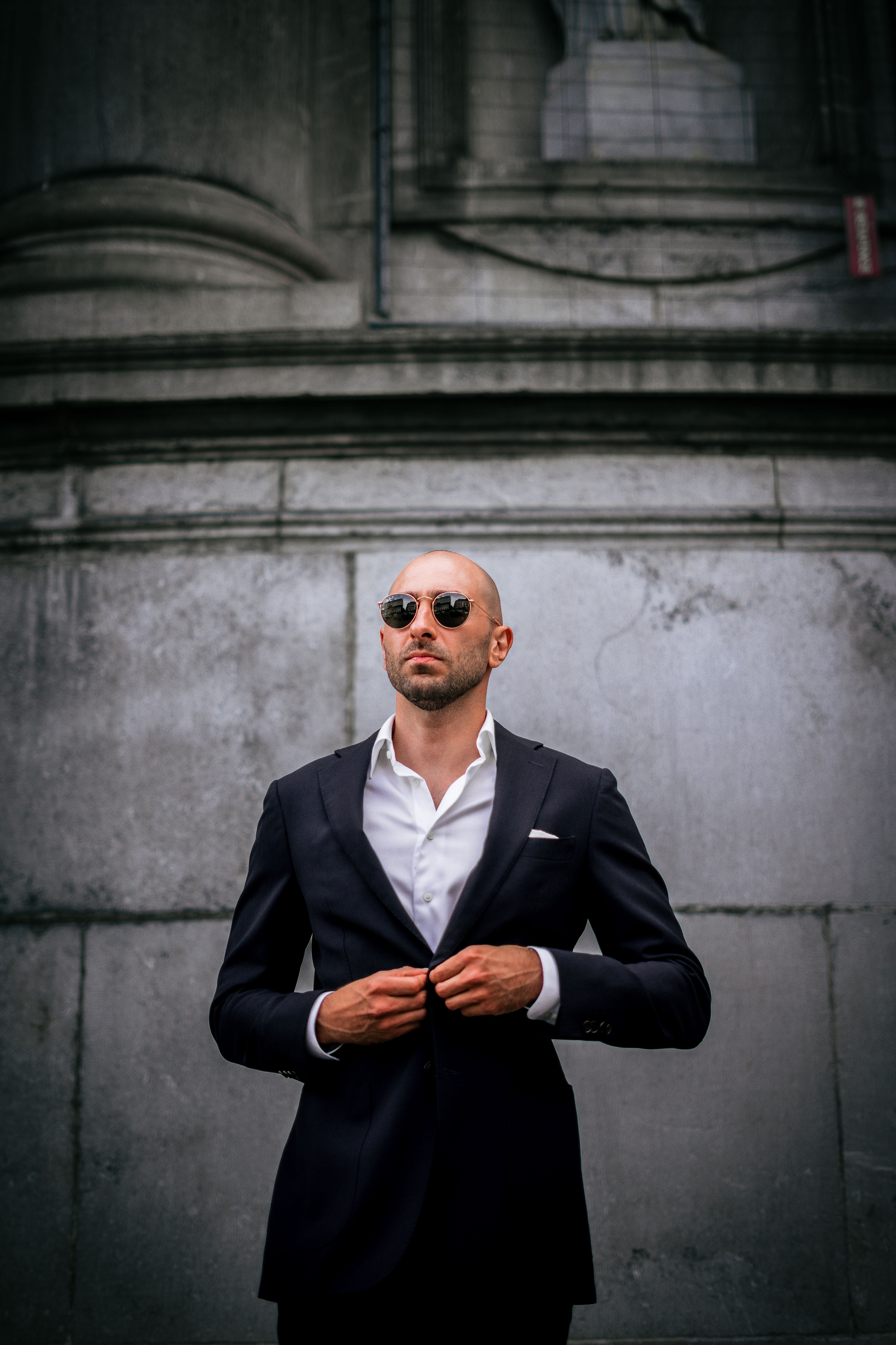 A Man in Black Suit Jacket Wearing Black Sunglasses · Free Stock Photo